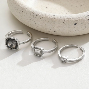 Three-piece geometric silver ring set with square black crystal and adjustable open bands