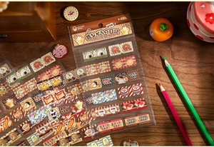 Detailed view of vintage food stickers with sushi and ramen illustrations on a wooden desk
