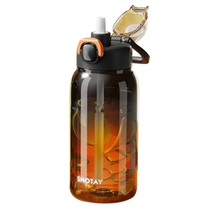 Amber Tritan water bottle with straw and handle shown on white background with lemon inside