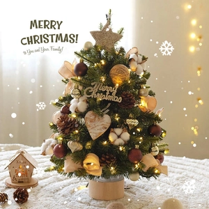 Mini tabletop Christmas tree with warm LED lights, pine cones and wooden base decor