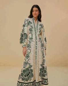 Detail of V-neckline and buttoned bodice on a long-sleeved floral print maxi dress