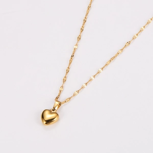 Minimalist gold stainless steel necklace with a 3D heart pendant on a thin lip chain