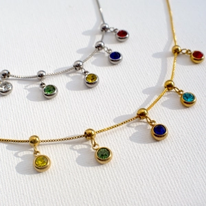 Gold and silver stainless steel snake chain necklaces with colorful birthstone pendants