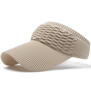 Close-up of beige knitted sun visor featuring wave texture and breathable mesh side