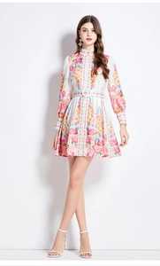 Detail of floral lantern sleeves and matching waist belt on a vintage white dress