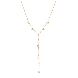 Minimalist golden Y-shaped long tassel necklace with metallic bead drops on white background