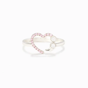 Detailed close-up of heart-shaped ring with pink diamonds and semi-colon design