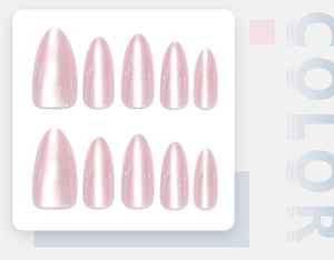Detail of almond-shaped light pink press-on nails with pearl luster and glitter finish