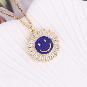 Golden sunflower pendant necklace with blue enamel smiley face and zircon inlay