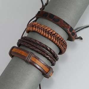 Set of four vintage handmade leather bracelets for men in brown and dark brown styles