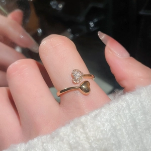 Close-up of 18k gold plated double heart open ring with sparkling cubic zirconia stones