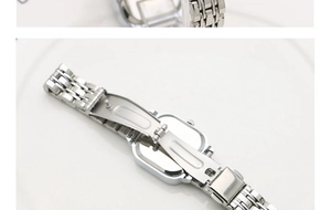 Close-up of the stainless steel five-link strap and folding clasp on a square watch