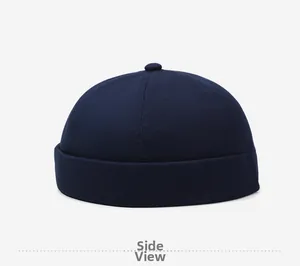 Side view of dark blue cotton docker cap featuring classic dome stitch and rolled brim