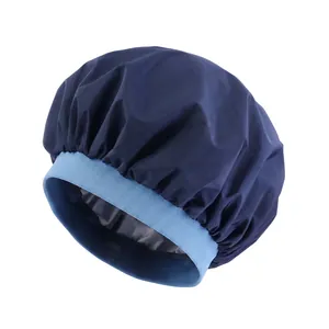 Detail of waterproof hair cap with elastic wide band and dark blue pleated fabric