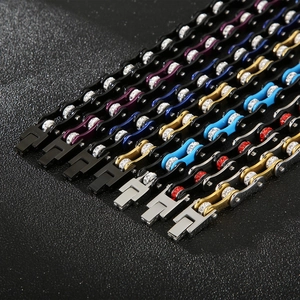 Detail of bike chain link bracelets with inlaid zircons in various metallic finishes