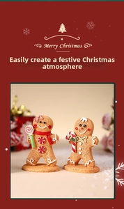 Close-up of resin gingerbread man figurines with candy canes on snowy holiday base