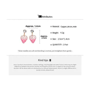 Detailed spec sheet showing pink strawberry earrings with dimensions and material info
