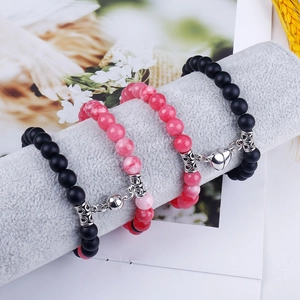 Detail showing 8mm matte black and pink marble stone beads with heart magnetic clasps