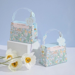 Floral wedding gift boxes with chain handles and Best Wishes text on blue background