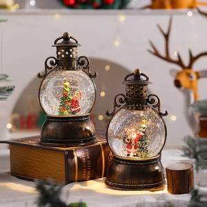 Detail of vintage Christmas lanterns with LED lighting and swirling snow globes