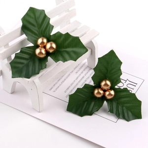 Festive Christmas holly leaf and golden berry pick for holiday DIY crafts and decor