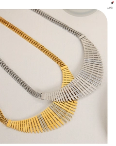 Detail of gold and silver choker necklaces featuring a radial rhinestone lattice design