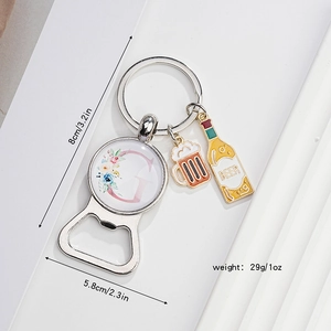 Detail of metal bottle opener keychain with letter G charm and size dimensions
