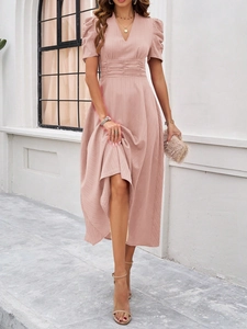 Detail of elegant pink V-neck midi dress featuring smocked waist and vertical textures