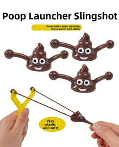 Action shot of stretchy emoji slingshot toy set with brown sticky projectiles for fun