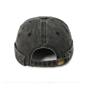 Detail view of adjustable metal buckle and back strap on washed denim miki hat
