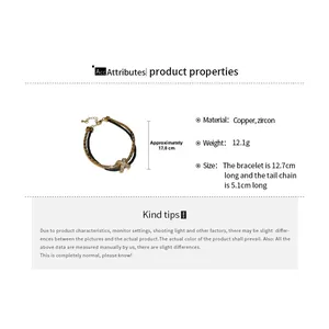 Détail du bracelet croix avec motif tissé en cuivre et zircon et longueur de 17,8 cm