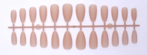Detailed view of matte nude almond press-on nails set with 24 pieces on a plastic rack