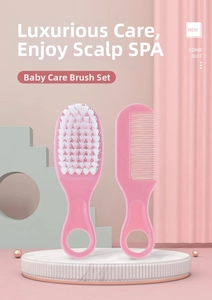 Pink infant hairbrush and comb set detail on marble platform with soft bristles