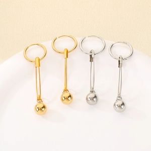 Minimalist geometric safety pin earrings with polished metal spheres in gold and silver