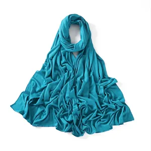 Macro detail of lake blue jersey hijab showing soft texture and fine hemmed edges