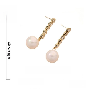Detail showing 5.3cm long pearl drop earrings with 925 silver needle and 6.5g weight