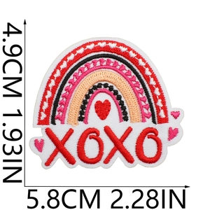 Macro detail of rainbow heart embroidery patch with XOXO text measuring 4.9cm x 5.8cm