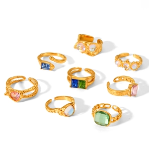 Vintage gold hammer-textured ring set with colorful zircons and adjustable open bands