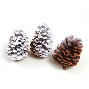 Three decorative flocked pine cones with white snow effect for Christmas home decor