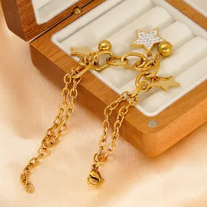 18k gold plated stainless steel star bracelet with zircon inlay on silk background