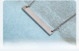 Macro detail of 35mm blank bar necklace with mirror polished stainless steel finish