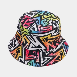 Detailed close-up showing the vibrant graffiti pattern and texture of this bucket hat