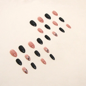 Chic almond press-on nails with black solid color and red speckled patterns in 24pcs set