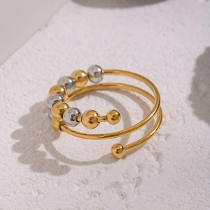 Anello fidget con spirali bicolore argento e oro e perline metalliche scorrevoli