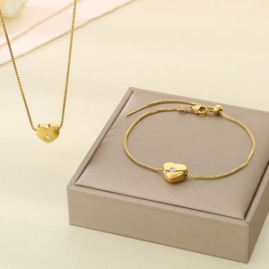 Parure de bijoux en acier inoxydable doré 18 carats avec collier et bracelet cœur