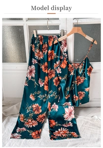 Detail of floral satin pajama set featuring V-neck camisole and wide-leg trousers