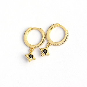 Elegant gold hoop earrings featuring square black gemstone drops with beaded borders