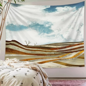 Detailed close-up of wall tapestry showing abstract mountains and tree art in modern bedroom