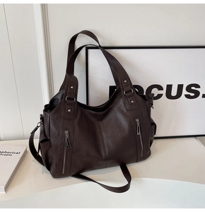 Detail view of the deep brown large capacity tote bag with removable long shoulder straps