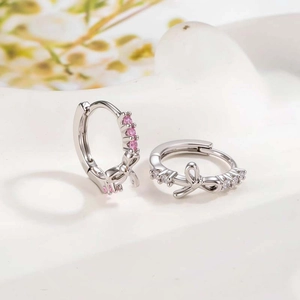 Exquisite silver bow earrings with micro-set pink and clear zircon crystals